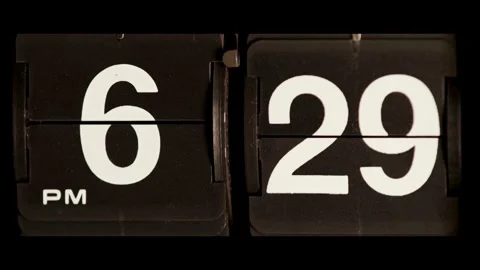 Retro flip clock changing from six twenty nine pm Stock Footage 329667716