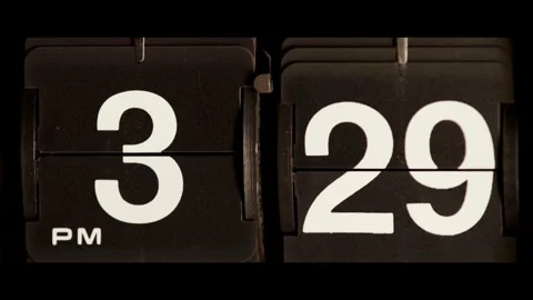Retro flip clock changing from three twenty nine pm Stock Footage 329667703