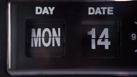 Retro flip clock cycling through day and date numbers, dark moody lighting, Stock Footage 343425255