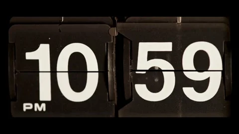Retro flip clock mechanism changing from ten fifty nine Stock Footage 329667653