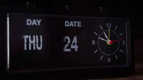 Retro flip clock with moving second hand, day and date display, vintage Stock Footage 342637668