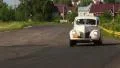 Retro Ford Coupe Chevrolet Fangio Bentley Drophead driving fast over countryside HD Footage
