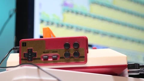 Retro gaming console and controller bringing back nostalgia Stock Footage 302797928