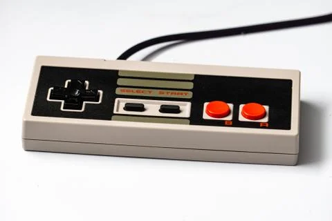 Retro gaming controller with cable on white background 写真素材