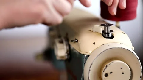 Retro German sewing machine. The process of winding the thread on the bobbin Stock Footage 148578623