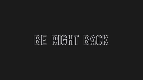 Retro glitch be right back outline text on black background Video stock 315847474
