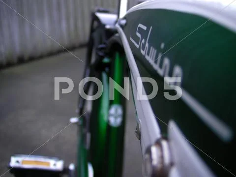 Retro green bicycle close up of rear wheel and pedal Stock Photos