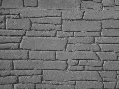 Retro image - Architectonic pattern with irregular stone bricks. Stock Photos