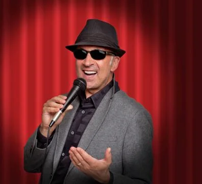 Retro image of man singing into microphone Stock Photos