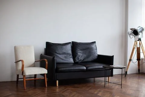 Retro interior with black sofa. Stock Photos