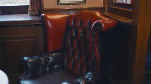 Retro interior of restaurant or bar with leather armchairs and wooden table Stock Footage 146913995