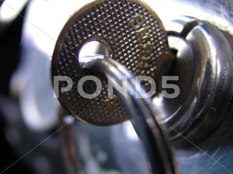Retro key in ignition close up detail Stock Photos