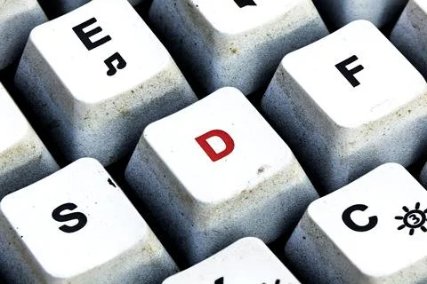 Retro Keyboard with D button in red color. D button keyboard in close up macr Stock Photos