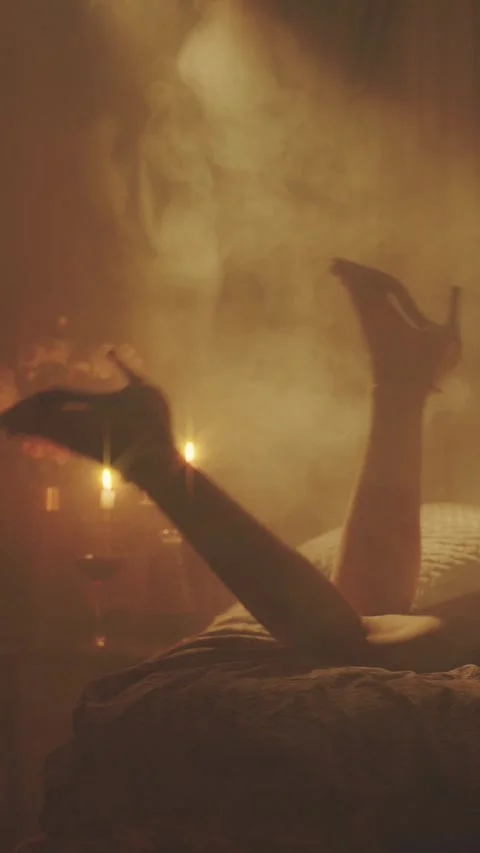 Retro lady lying on bed close-up shoot long legs waving. Happy sexy woman 스톡 동영상 311939198