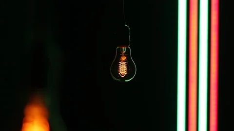 Retro lamp hanging on black background with led stripes. Stock Footage 146009689