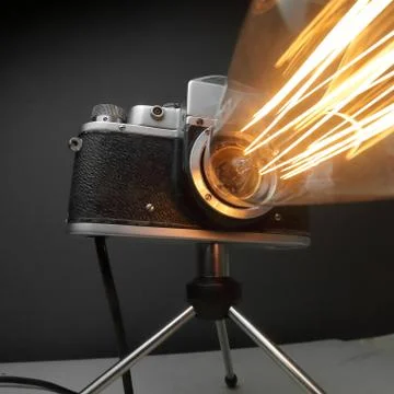 Retro lamp from an old camera with an Edison lamp. Concept is a good idea. Stock Photos