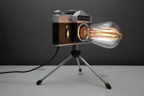 Retro lamp from an old camera with an Edison lamp. Concept is a good idea. Stock Photos