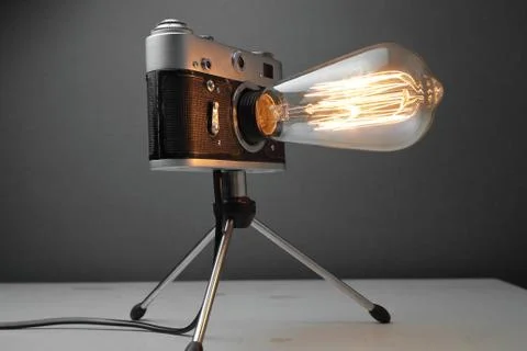 Retro lamp from an old camera with an Edison lamp. Concept is a good idea. Stock Photos