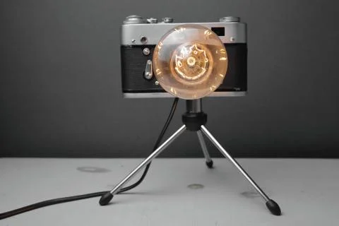 Retro lamp from an old camera with an Edison lamp. Concept is a good idea. Stock Photos