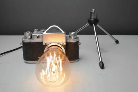 Retro lamp from an old camera with an Edison lamp. Concept is a good idea. Stock Photos