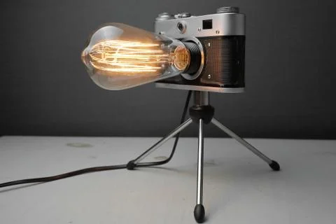 Retro lamp from an old camera with an Edison lamp. Concept is a good idea. Stock Photos
