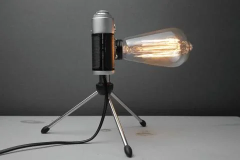 Retro lamp from an old camera with an Edison lamp. Concept is a good idea. Stock Photos