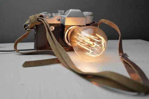 Retro lamp from an old camera with an Edison lamp. Concept is a good idea. Stock Photos