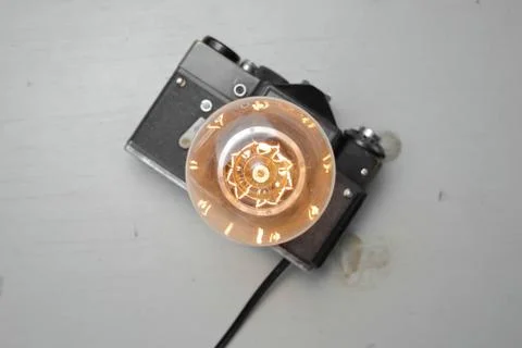 Retro lamp from an old camera with an Edison lamp. Concept is a good idea. Stock Photos
