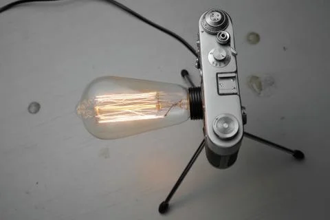 Retro lamp from an old camera with an Edison lamp. Concept is a good idea. Stock Photos