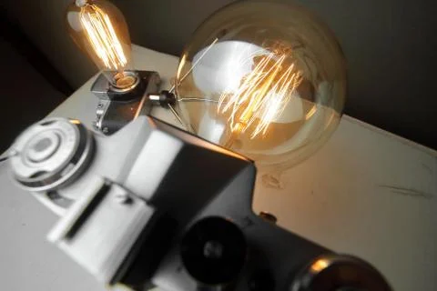 Retro lamp from an old camera with an Edison lamp. Concept is a good idea. Stock Photos