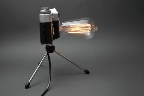 Retro lamp from an old camera with an Edison lamp. Concept is a good idea. Stock Photos
