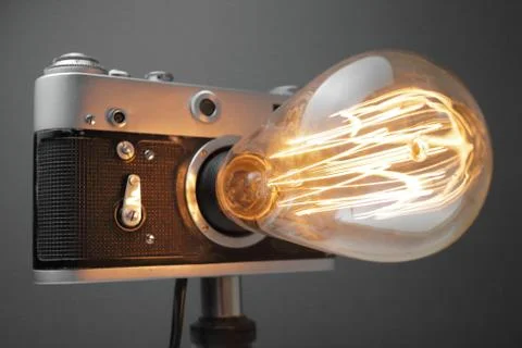 Retro lamp from an old camera with an Edison lamp. Concept is a good idea. Stock Photos