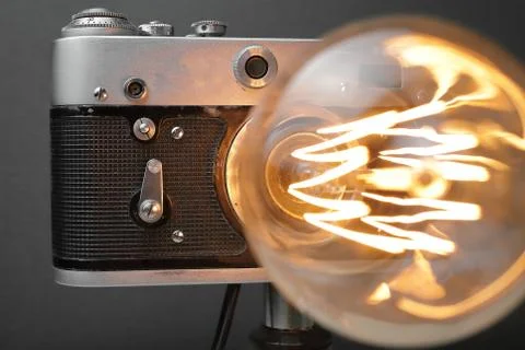 Retro lamp from an old camera with an Edison lamp. Concept is a good idea. Stock Photos