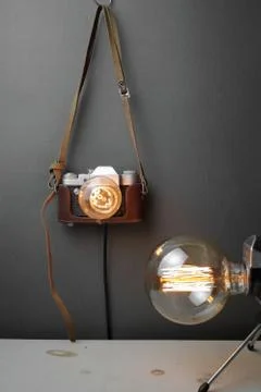 Retro lamp from an old camera with an Edison lamp. Concept is a good idea. Stock Photos