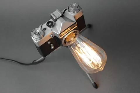 Retro lamp from an old camera with an Edison lamp. Concept is a good idea. Stock Photos