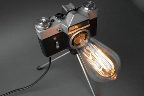 Retro lamp from an old camera with an Edison lamp. Concept is a good idea. Stock Photos