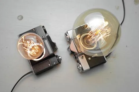Retro lamp from an old camera with an Edison lamp. Concept is a good idea. Stock Photos