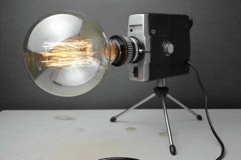 Retro lamp from an old camera with an Edison lamp. Concept is a good idea. Stock Photos