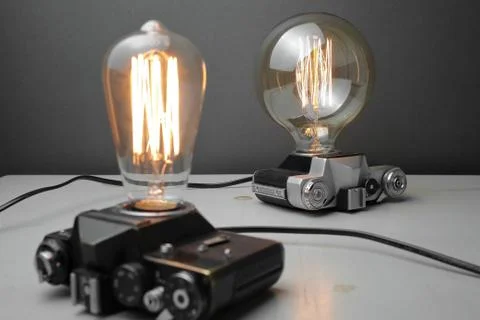 Retro lamp from an old camera with an Edison lamp. Concept is a good idea. Stock Photos