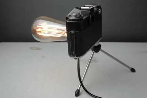 Retro lamp from an old camera with an Edison lamp. Concept is a good idea. Stock Photos