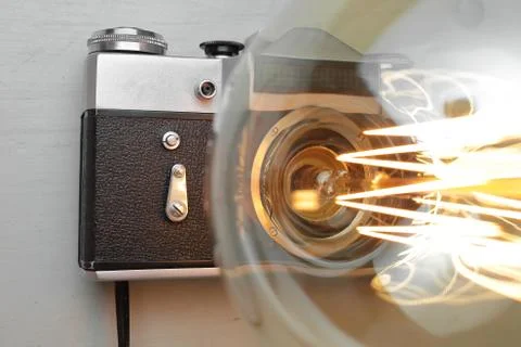 Retro lamp from an old camera with an Edison lamp. Concept is a good idea. Stock Photos