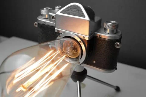 Retro lamp from an old camera with an Edison lamp. Concept is a good idea. Stock Photos