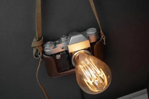 Retro lamp from an old camera with an Edison lamp. Concept is a good idea. Stock Photos