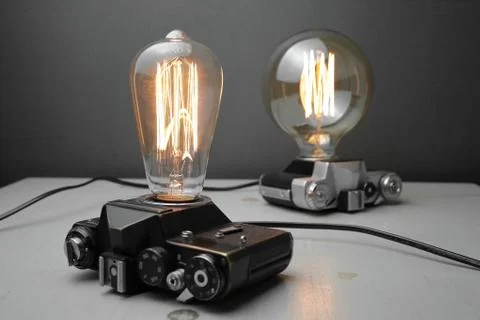 Retro lamp from an old camera with an Edison lamp. Concept is a good idea. Stock Photos