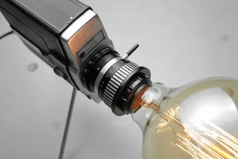 Retro lamp from an old camera with an Edison lamp. Concept is a good idea. Stock Photos