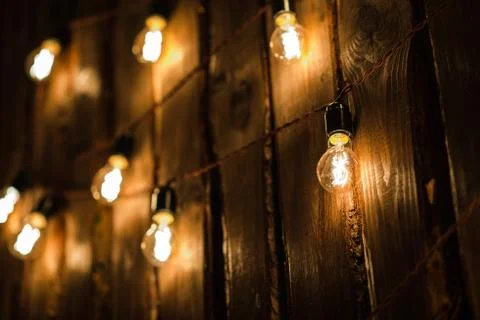 Retro Lamp With Plug And Cable Hanging On The Wooden Wall Stock Photos