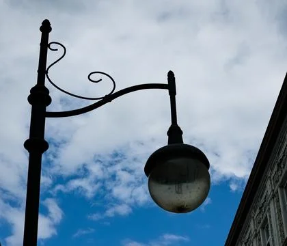 Retro lantern on the background of the blue sky. vintage lantern. A street .. Stock Photos