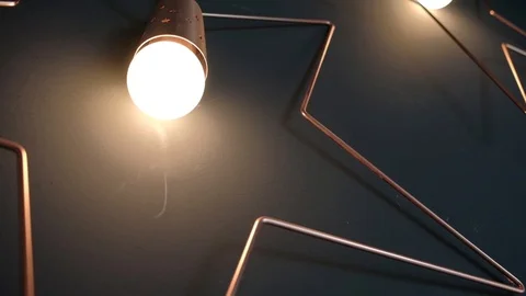 Retro light bulbs of the Edison, on dark wall, loft design Stock Footage 129084992
