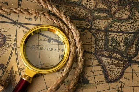 Retro magnifier with old map 写真素材