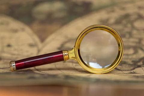 Retro magnifier with old map Stock-Fotos